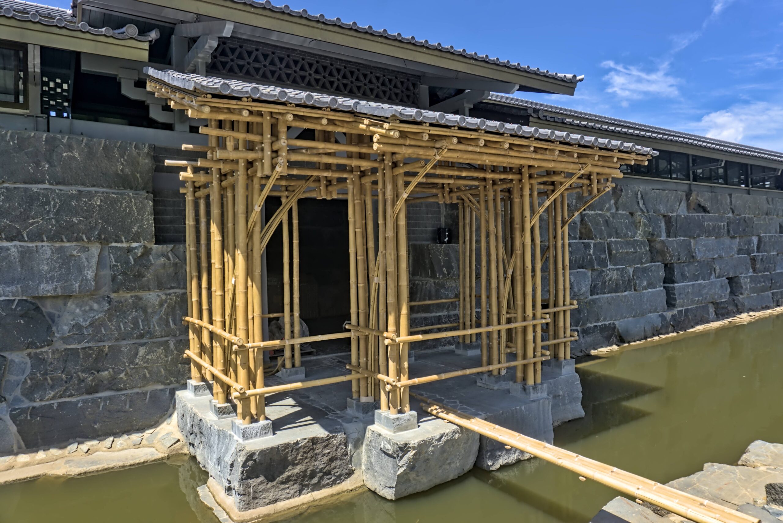 The photo of bamboo veranda within a stone temple